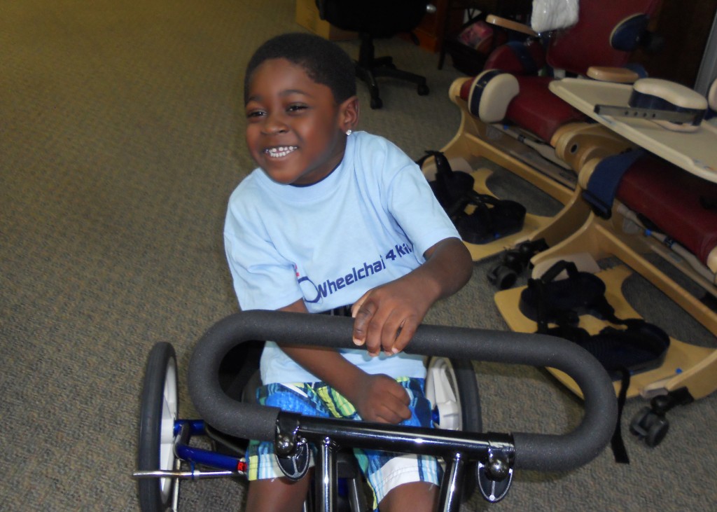 Tyrie trying out his adaptable trike